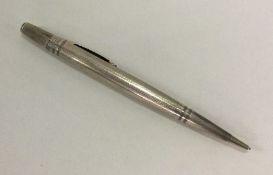 A heavy engine turned silver pencil of typical for