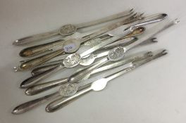 A large group of twelve silver plated lobster pick