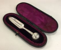 An attractive engraved silver cheese scoop decorat