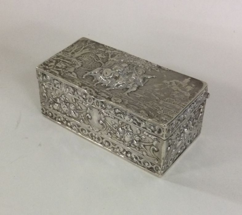 A heavy cast silver snuff box decorated with figur