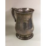 A heavy George II silver mug on spreading foot. Lo