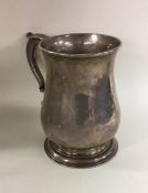 A heavy George II silver mug on spreading foot. Lo