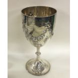 A massive silver goblet decorated with swags. Lond