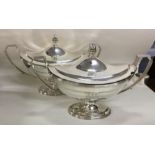 A fine pair of Georgian silver tureens with creste