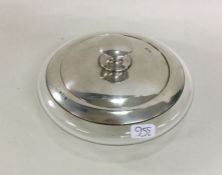 A cylindrical silver mounted powder jar and cover.