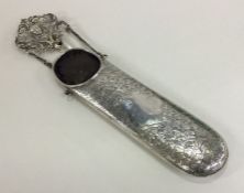 A silver spectacle case with engraved decoration.