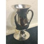 An attractive silver three handled cup / vase with