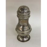 A good Georgian silver baluster shaped muffineer o