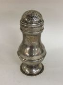 A good Georgian silver baluster shaped muffineer o