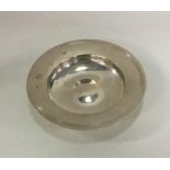 A heavy circular silver armada dish of typical for