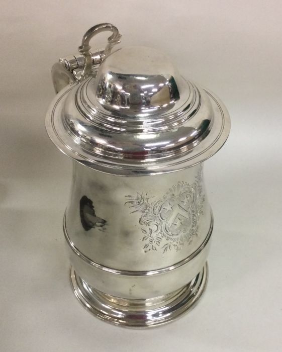 A good Georgian silver lidded tankard with crested