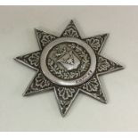 An unusual silver medal in the form of a star with