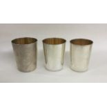 A good set of three tapering silver stacking beake