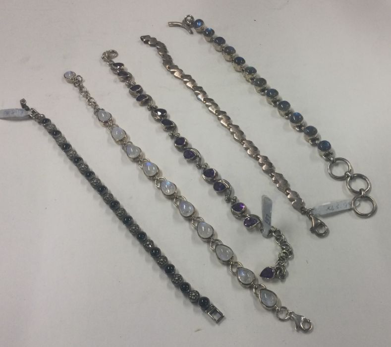 A collection of silver line bracelets. Approx. 80