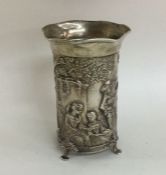 A chased silver vase decorated with a romantic sce