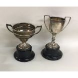 Two silver mounted trophy cups on ebony stands. Va