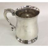 A good Georgian silver half pint mug on spreading