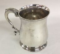 A good Georgian silver half pint mug on spreading