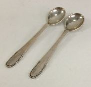 GEORG JENSEN: A pair of stylish silver salt spoons