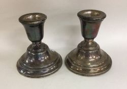 A pair of circular silver dwarf candlesticks. Birm