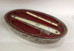 An unusual French silver manicure set of shaped fo