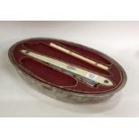An unusual French silver manicure set of shaped fo