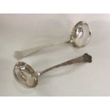A pair of Edwardian silver cream ladles with taper