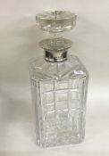 A large heavy silver and glass mounted decanter. S