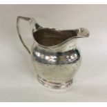 A good George III silver cream jug attractively de