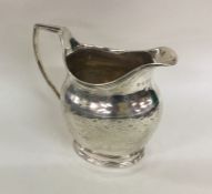 A good George III silver cream jug attractively de