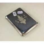 An Eastern silver and Niello cigarette case. Appro