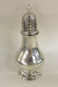 A good Georgian baluster shaped silver caster with