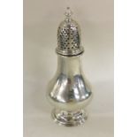 A good Georgian baluster shaped silver caster with