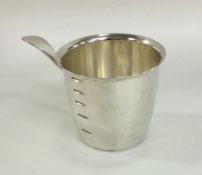 WELSCH: A Peruvian silver measuring cup with lip h