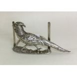 An unusual Edwardian silver menu holder cast with