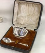 A cased silver christening spoon and bowl. Sheffie