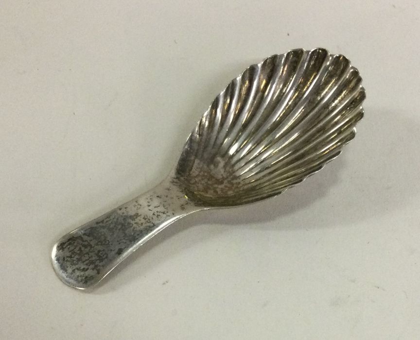 A good silver caddy spoon with fluted bowl. London