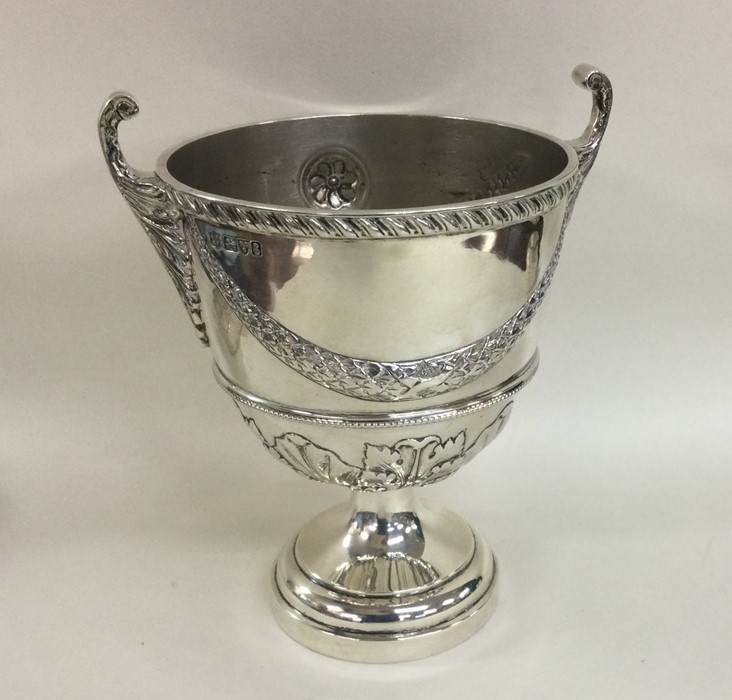 An attractive Edwardian silver sugar bowl with swa