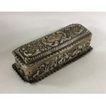 An embossed silver dressing table box decorated wi