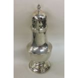 A large silver sugar caster with lift-off cover. B