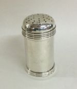 A heavy cylindrical pepper with reeded decoration.