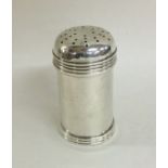 A heavy cylindrical pepper with reeded decoration.