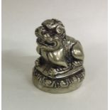 A silver gilt Dog of Foo in seated position. Appro