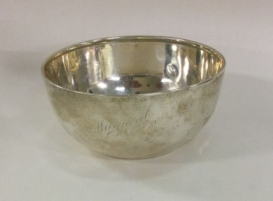 A heavy Edwardian silver sugar bowl of plain form.