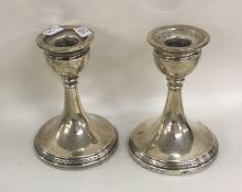 A pair of circular silver dwarf candlesticks. Birm