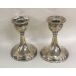 A pair of circular silver dwarf candlesticks. Birm