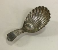 A Georgian silver caddy spoon with bright cut deco