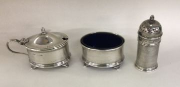 An engine turned silver three piece cruet with BGL