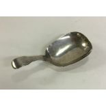 A good Georgian silver fiddle pattern caddy spoon.