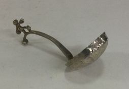 A Victorian silver ladle with chased bowl. London.